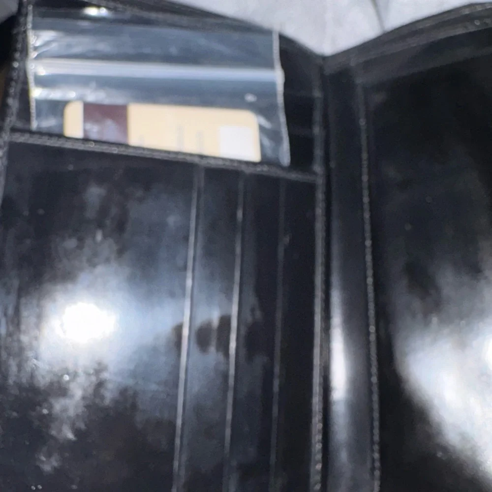 Prada Black Leather Wallet with‎ Minimalist Design